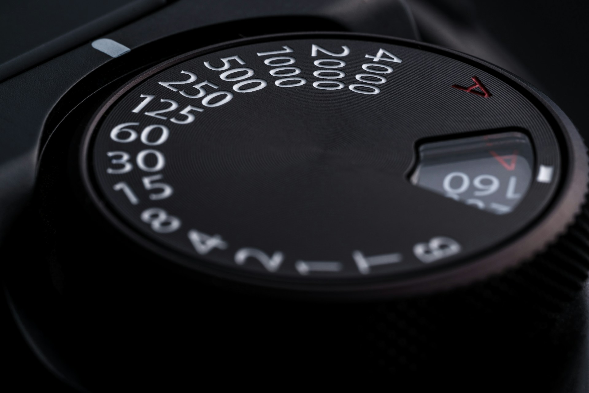 Close-up of a camera's mode dial with numbered settings