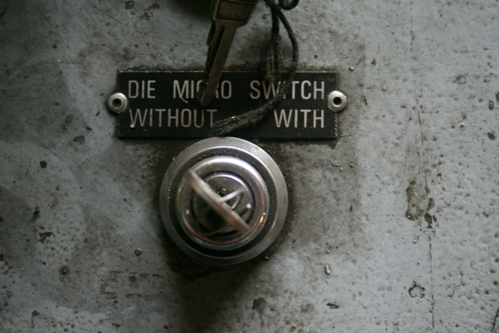 A vintage electrical switch with labelled settings